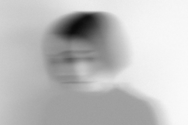 Blurred black-and-white portrait of a person, evoking the emotional fog of feeling unseen or unheard
